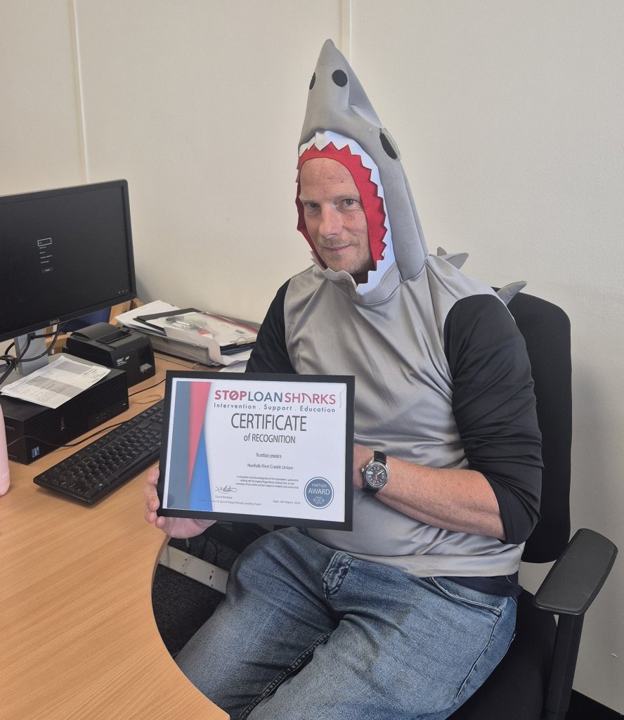 Norfolk First CU director Scott Porter with the Stop Loan Sharks certificate